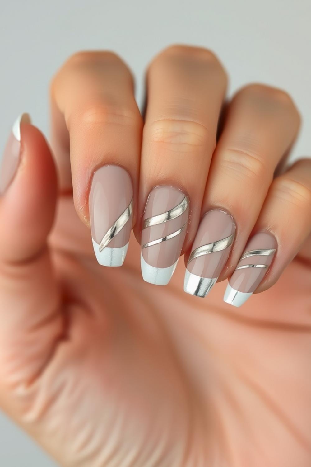 Silver chrome swirls on short squoval taupe nails
